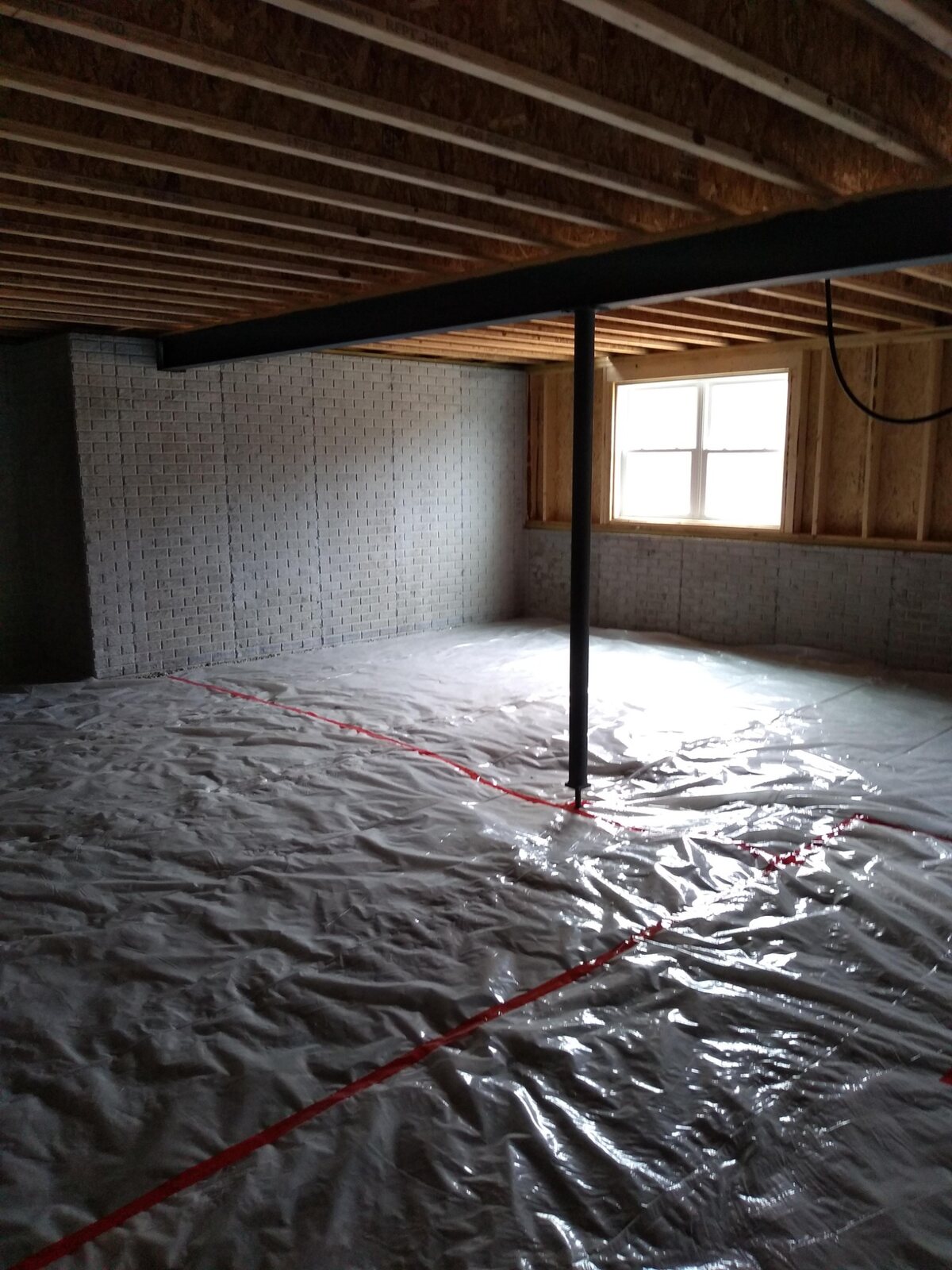 Unfinished basement before remodeling