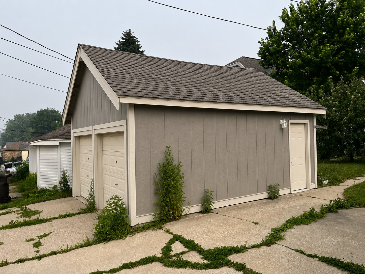 Client design rendering showing proposed vertical garage siding and white trim