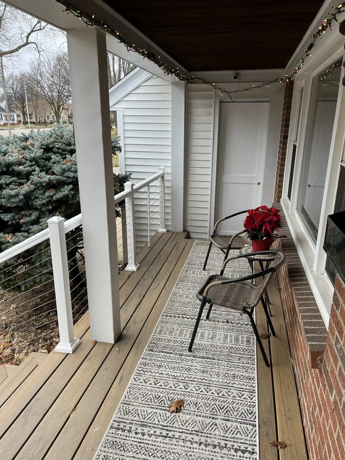 Finished porch seating area and cable railing